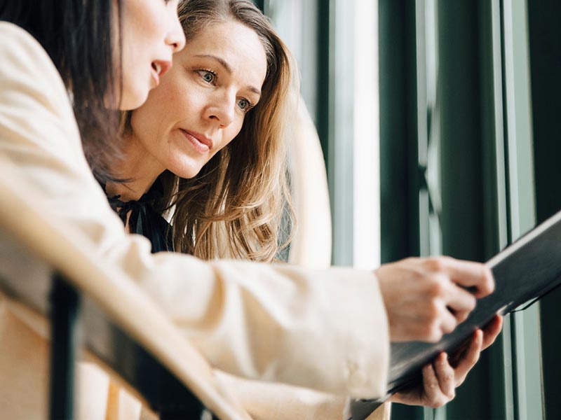 two female executives discussing hsbc cash management  two female executives discussing hsbc cash management